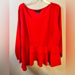 Red long sleeved ruffle top perfect for colder weather.